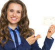 Smiling business woman pointing on air tickets