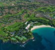Mauna Kea is one of the Big Island's top golf courses, with its iconic par-3 third hole (lower-left part of photo) playing over a corner of the Pacific. (Big Island Luxury/Harold Clarke)
