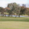 A view of green with water in background at Altona Lakes Golf Course